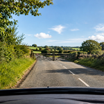 gated road ahead sign