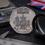 Genuine 50p VC coin being inspected with a magnifying glass for authenticity in the UK Select 85 more words to run Humanizer.